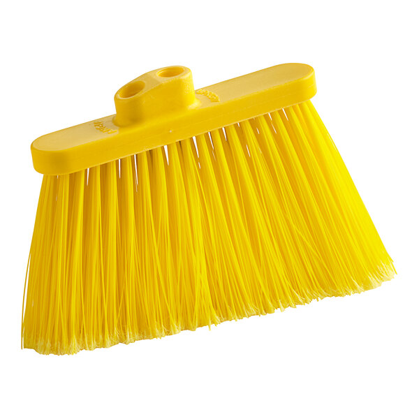 A close up of a yellow Lavex broom head with long, flagged bristles.