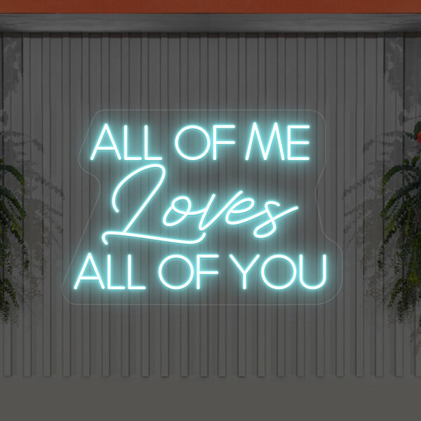 A Crazy Neon ice blue LED "All Of Me Loves All Of You" sign on a wall.