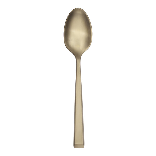 A Reserve by Libbey Santorini gold demitasse spoon with a white background.