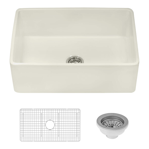 A white Ruvati farmhouse sink with a silver strainer and grid over the drain.