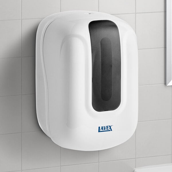 A white Lavex self-adjusting center pull paper towel dispenser on a white tile wall.