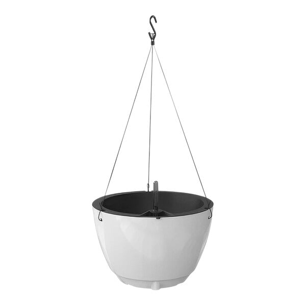 A white hanging planter with a metal hook.