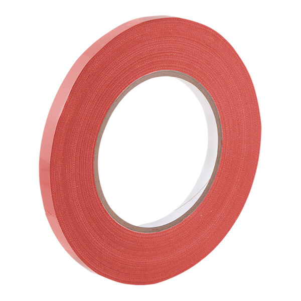 A close-up of a roll of red Tach-It UPVC bag sealing tape.