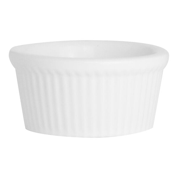 A close up of a Varick fluted ramekin with a ribbed edge on a white background.