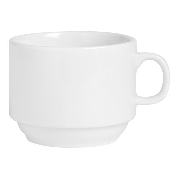 A white cup with a handle.