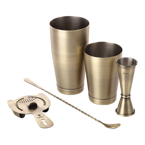 A Barfly antique gold metal bartender kit with a spoon.