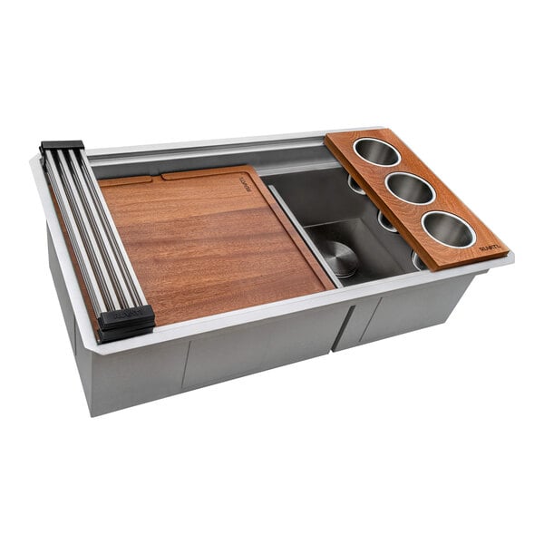 A stainless steel Ruvati workstation sink with a wood cutting board and a divider.