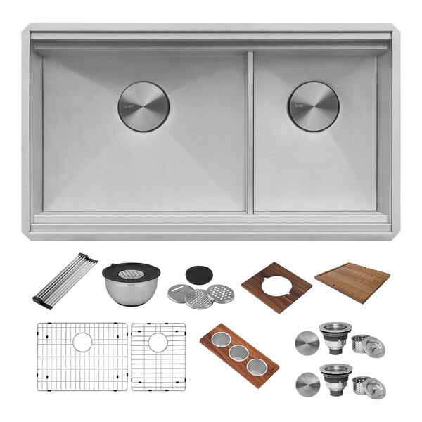 A Ruvati stainless steel workstation sink with various accessories on a counter.