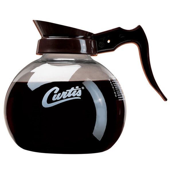 A Curtis glass coffee decanter with a brown handle.