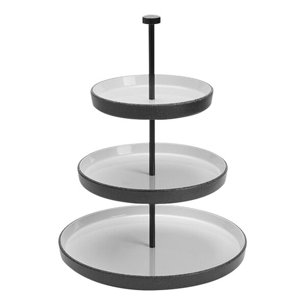 An American Metalcraft 3-tier white and black speckled display stand with round plates.