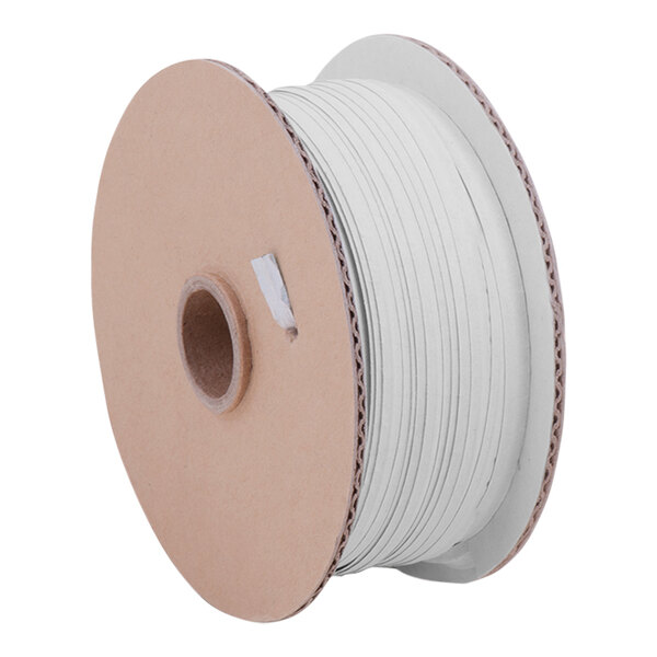 A Tach-It white plastic ribbon spool.