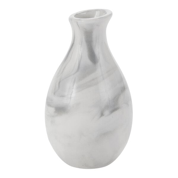 An American Metalcraft white marble ceramic jug vase with a marbled white and grey pattern.