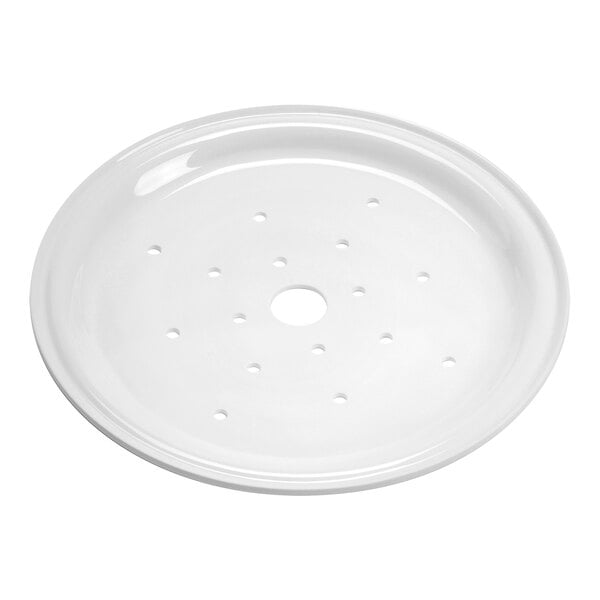 A white circular surface with holes in it.