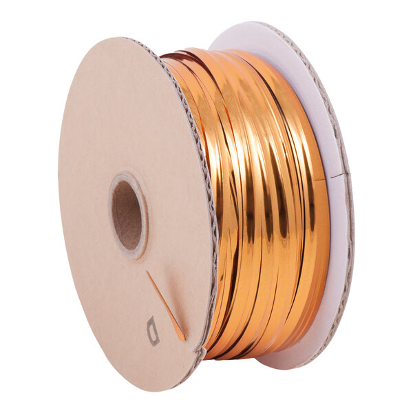 A Tach-It spool of gold wire for twist ties.