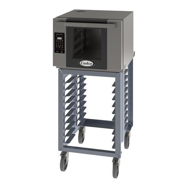 A Cadco Bakerlux countertop convection oven on a stand with wheels.