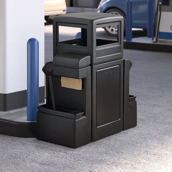 A black rectangular Lavex waste container with a black dome top.