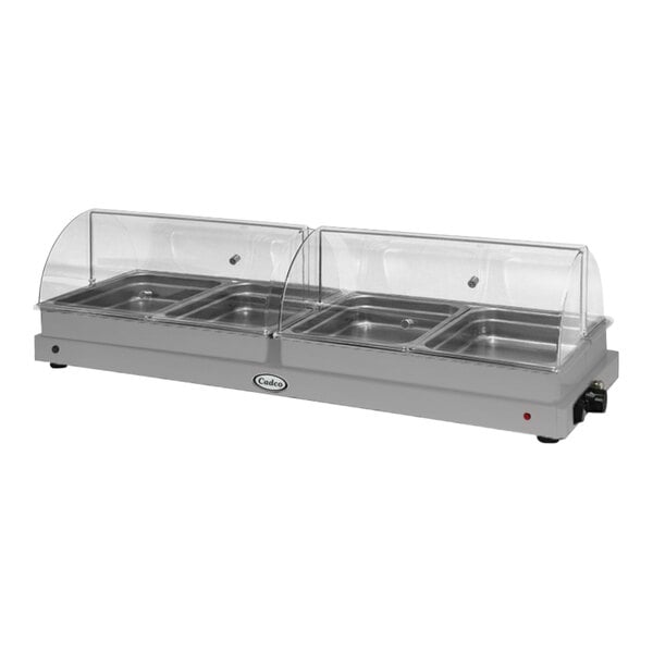 A Cadco countertop buffet server with roll top lids over four stainless steel trays.