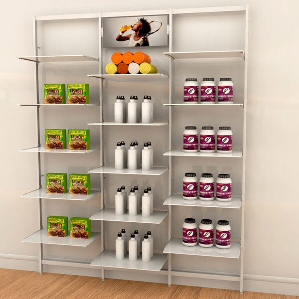 A white Udizine retail clothing display with shelves holding various types of food.