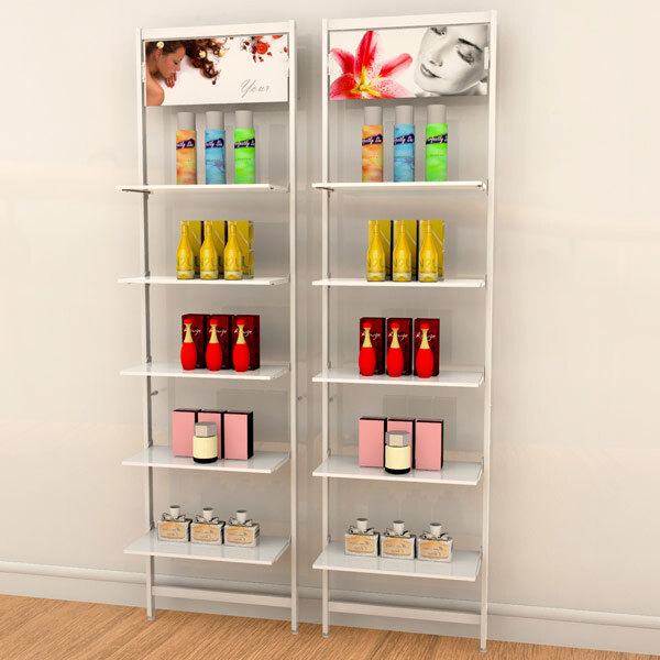 A white wall-mounted retail clothing display with shelves holding different colored bottles and cans.