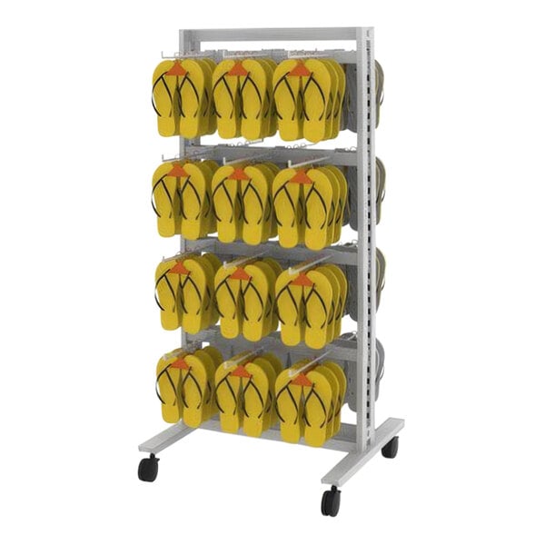 A white Udizine retail clothing display rack with yellow flip flops hanging on it.