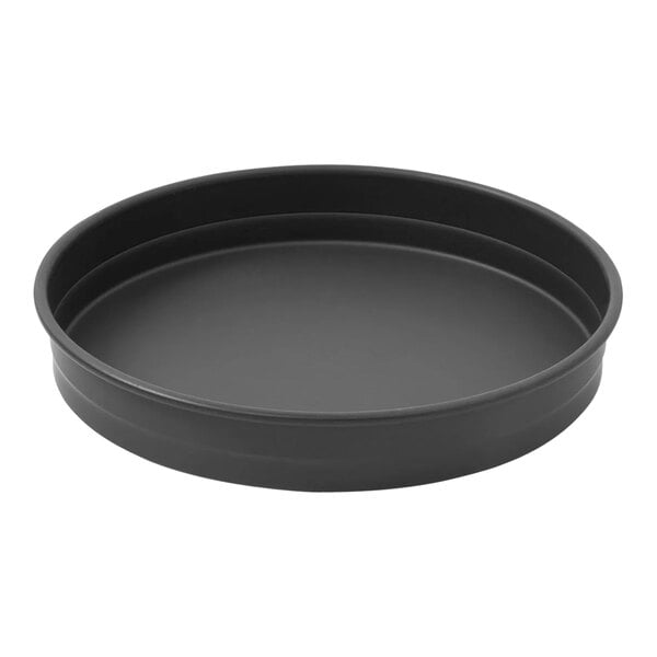 A black round LloydPans stackable deep dish pizza pan with straight sides.