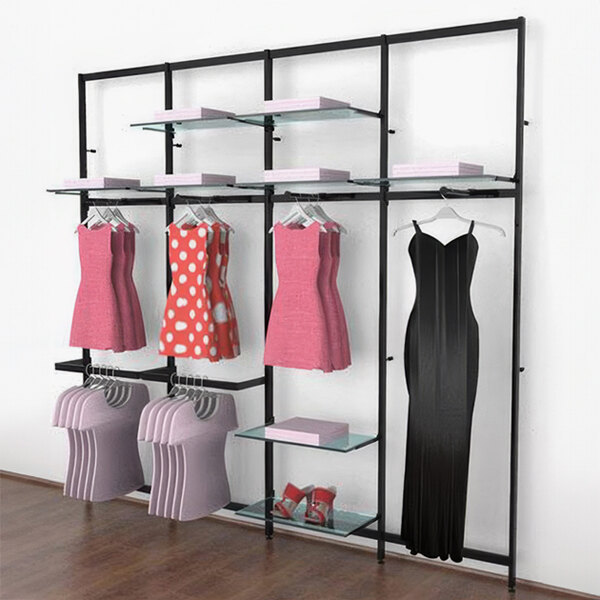 A black Udizine retail clothing rack with dresses and clothes on it.