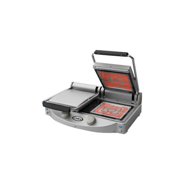 A Cadco commercial clamshell grill with smooth clear plates.