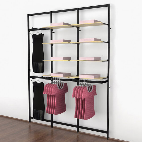 A black Udizine retail clothing display rack with clothes hanging on it.