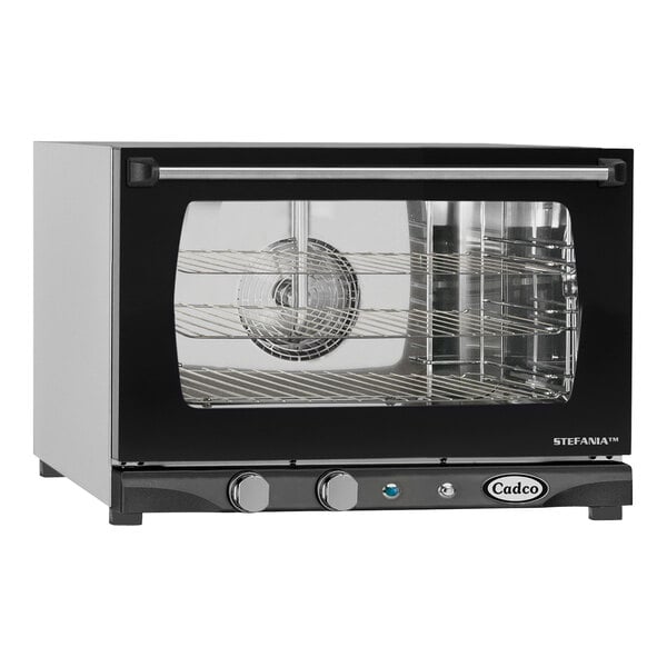 A black and silver Cadco countertop convection oven with a glass door.