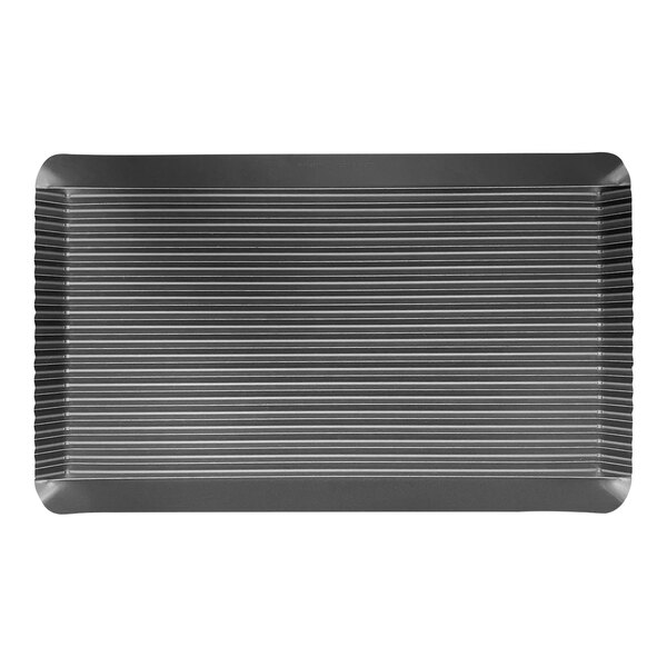 A close-up of a black rectangular LloydPans grill pan with lines on it.