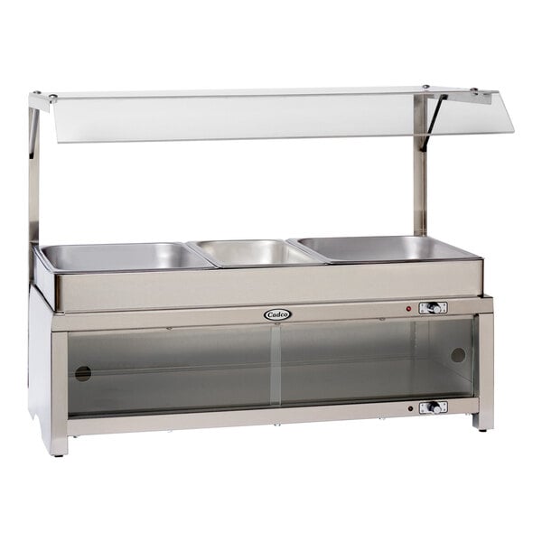 A Cadco countertop food warmer with glass shelves and a glass top.