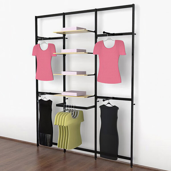 A black Udizine retail clothing rack with clothes on faceouts and a hanging rail.