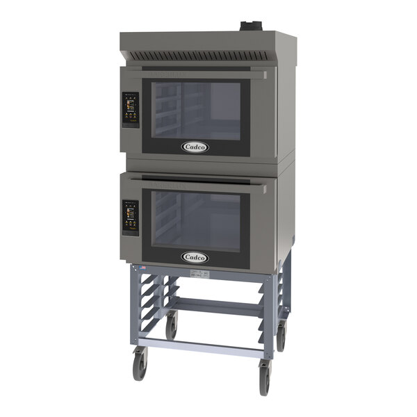 A Cadco Bakerlux double stacked countertop convection oven on a stand with wheels.