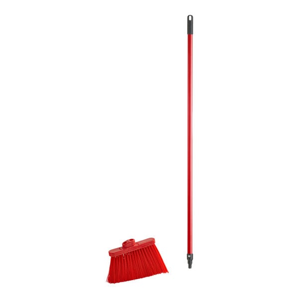 A red broom with a metal handle.