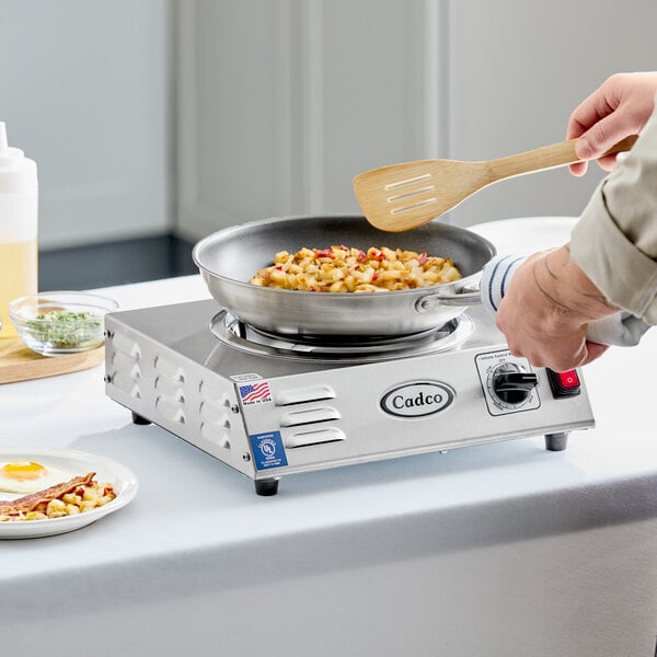 A stainless steel portable electric hot plate with a single burner and an 8-inch tubular element.
