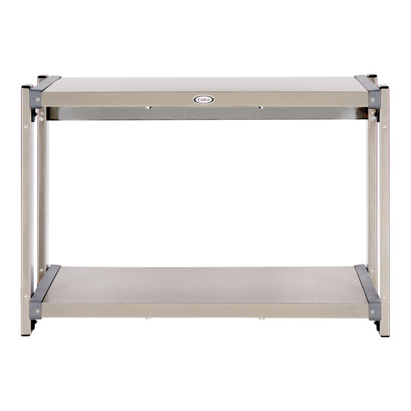 A rectangular metal table with two metal shelves on it.