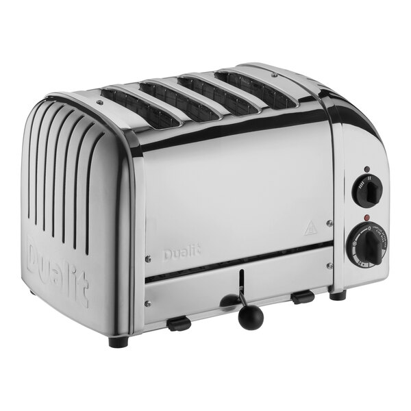 A silver Cadco commercial toaster with four slices of bread in it.