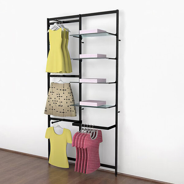 A black Udizine wall-mounted retail clothing rack with clothes hanging on it.