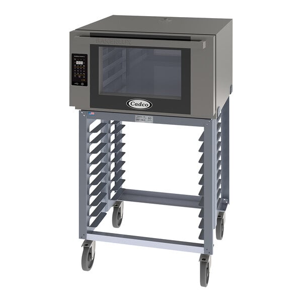 A Cadco Bakerlux countertop convection oven with a stand and wheels.