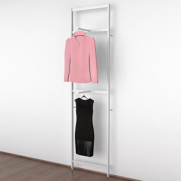 A white Udizine retail clothing display rack with white shelves and faceouts holding a pink dress and black shirt.