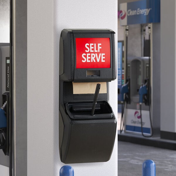 A black Lavex wall-mounted windshield wash station with a paper towel dispenser and squeegee.