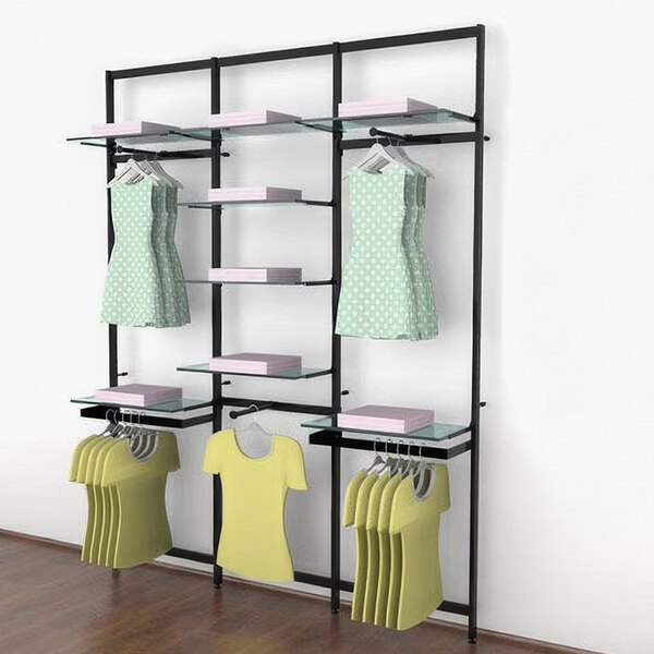 A black Udizine retail clothing display rack with clothes on faceouts and hanging rails.