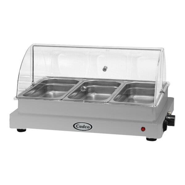 A Cadco stainless steel countertop food warmer with three compartments and a roll top lid.