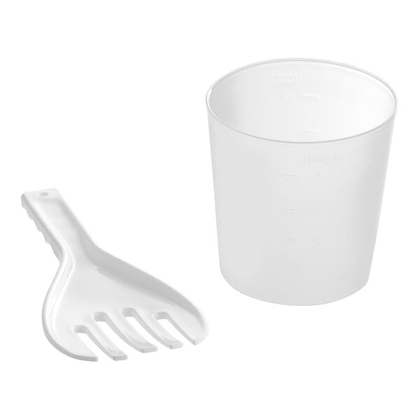 A white plastic measuring cup and spoon with a plastic cup with a handle.