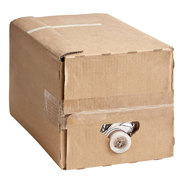 A cardboard box with a white lid and a white handle for Cholaca Pure Unsweetened Liquid Cacao Concentrate.