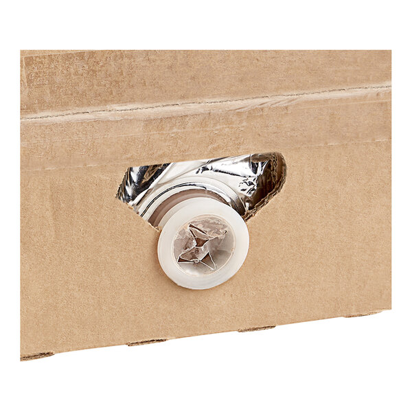 A cardboard box with a white button on the lid.