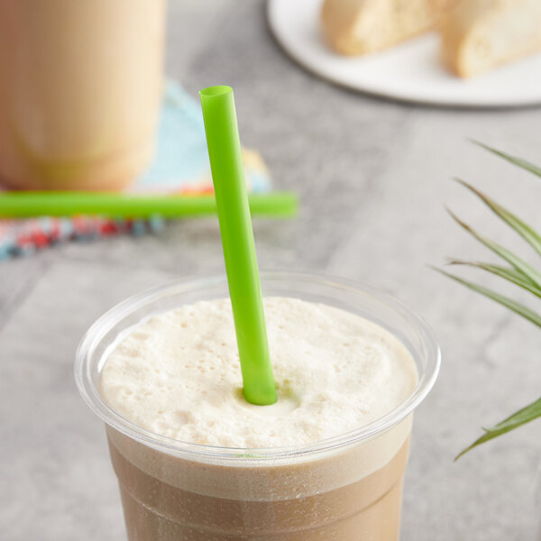 A cup of iced coffee with a EcoChoice Green Giant PLA straw in it.