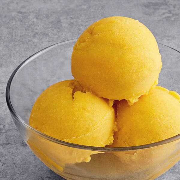 Three scoops of Tropical Acai Mango Sorbet in a bowl.