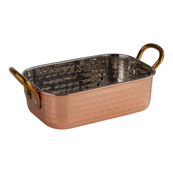 An APS Mumbai rectangular hammered copper serving pot with handles.