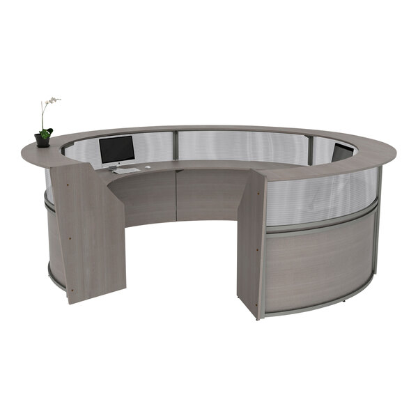 A curved reception desk with an ash laminate top.
